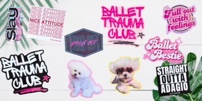 10 Ballet Trauma Club waterproof stickers in sparkly and glossy finishes, featuring witty ballet sayings, arranged on a pink backdrop beside a water bottle and laptop.