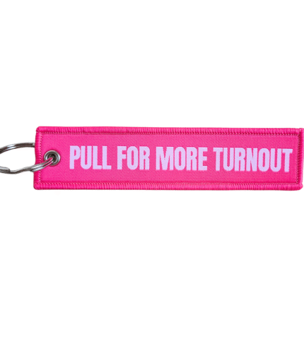 hot pink keychain that reads "Pull For More Turnout"