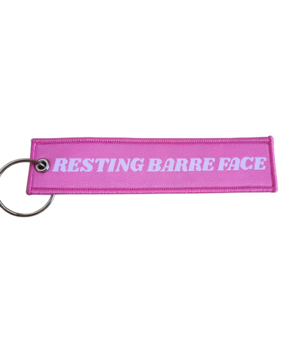 Woven keychain in pink with words reading "Resting Barre Face"