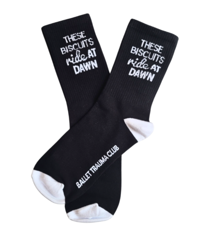Black socks with These Biscuits Ride At Dawn text for Ballet Trauma Club